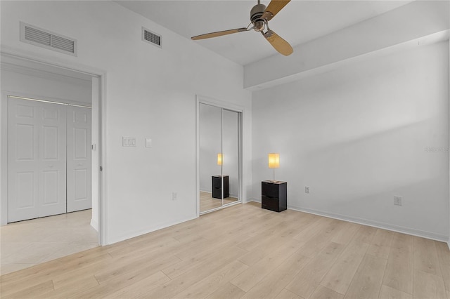 unfurnished bedroom with light hardwood / wood-style floors and ceiling fan