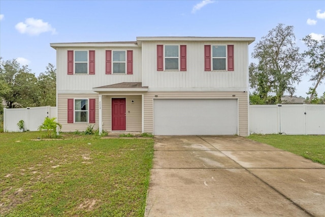 view of front of home with a garage and a front lawn