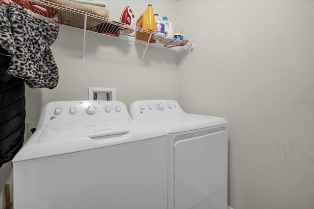 clothes washing area featuring washing machine and dryer