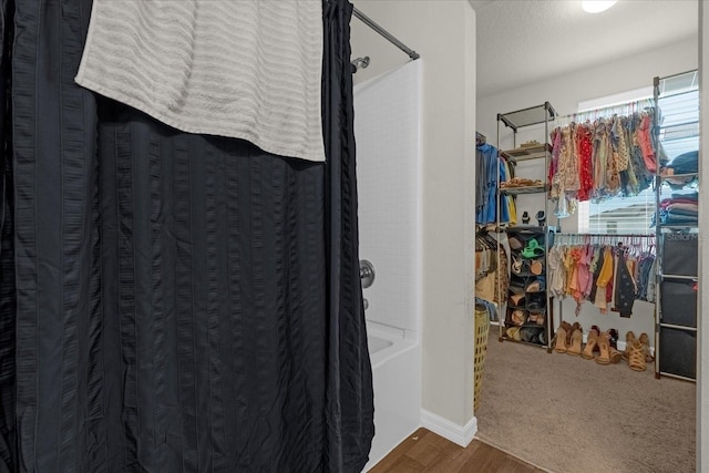 spacious closet with hardwood / wood-style floors