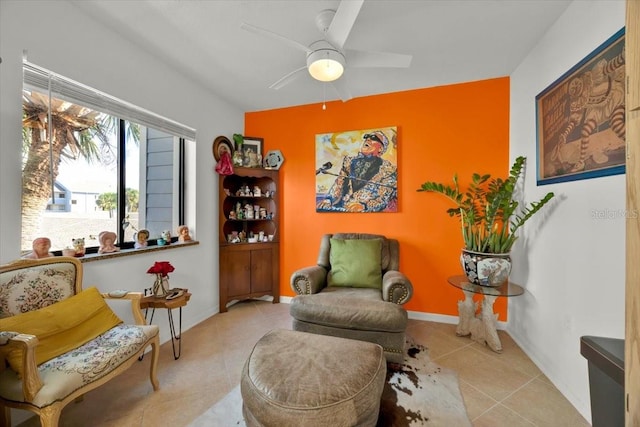 sitting room with ceiling fan and light tile patterned floors