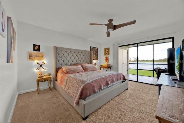 carpeted bedroom featuring access to outside and ceiling fan