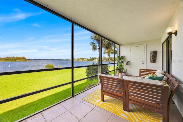 sunroom / solarium with a water view