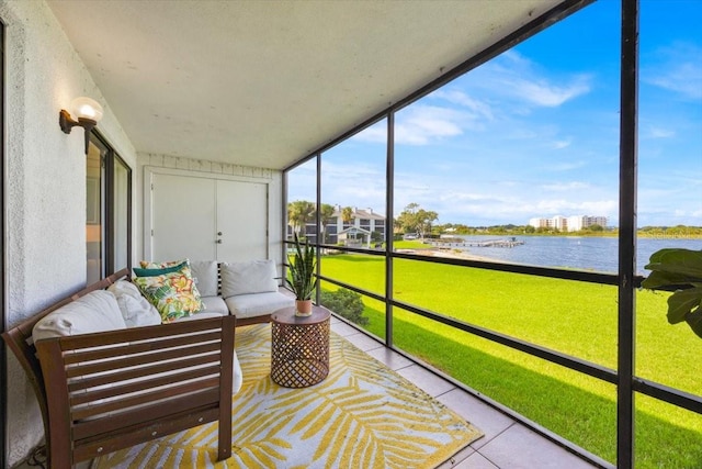 sunroom / solarium with a water view