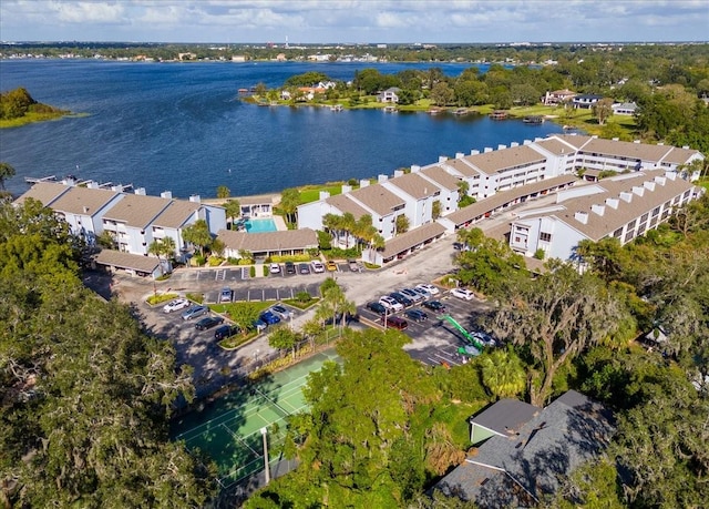 birds eye view of property with a water view