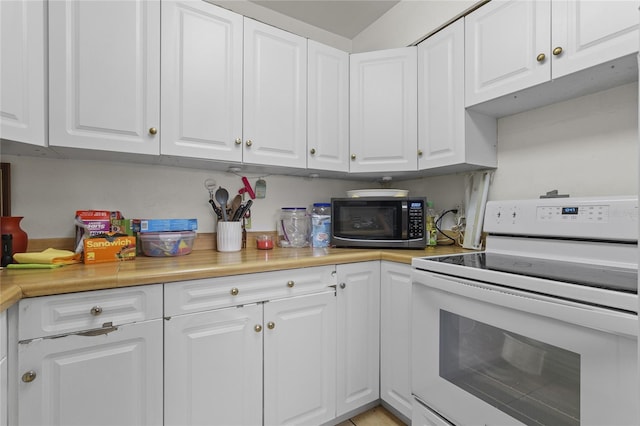 kitchen featuring white stove and white cabinets