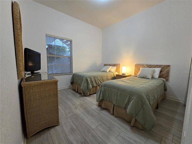 bedroom with light wood-type flooring