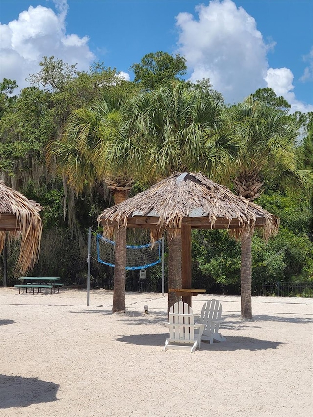 surrounding community with a gazebo and volleyball court