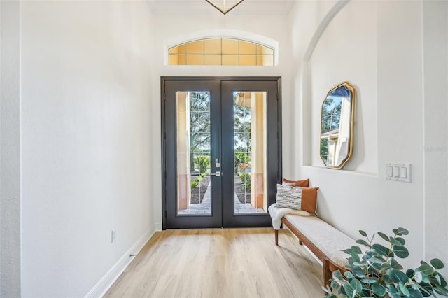 foyer with french doors and light wood-type flooring