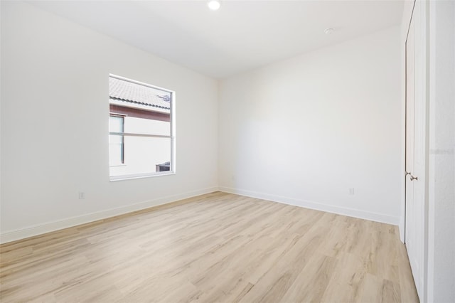 unfurnished room featuring light wood-type flooring