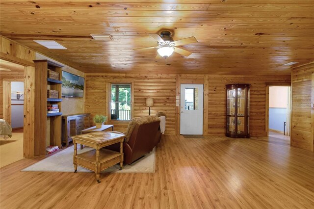 living room with light hardwood / wood-style floors, wooden ceiling, and ceiling fan