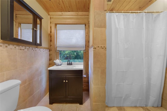 bathroom with vanity, toilet, tile walls, and wood ceiling