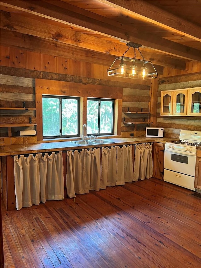 kitchen featuring dark hardwood / wood-style flooring, decorative light fixtures, and white appliances