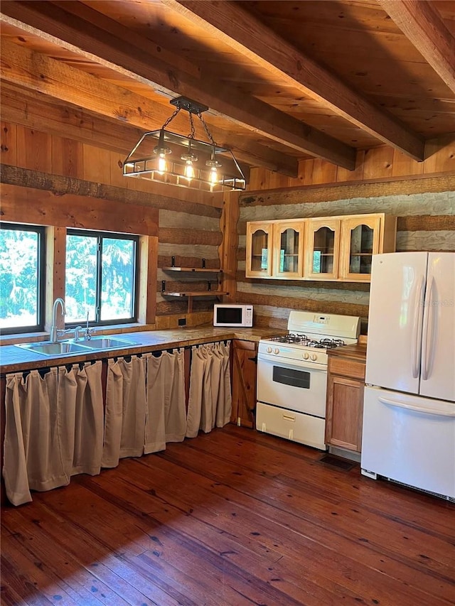 kitchen with dark hardwood / wood-style flooring, beamed ceiling, pendant lighting, and white appliances