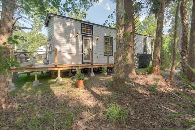 rear view of property with a deck