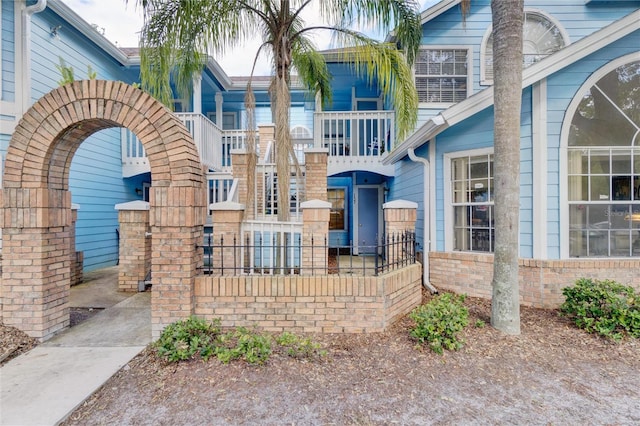 view of front of home with a balcony