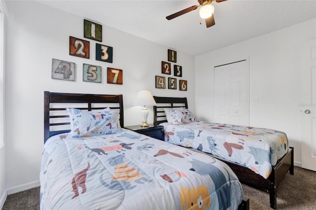 bedroom featuring a closet, carpet floors, a textured ceiling, and ceiling fan