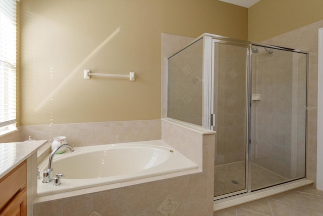 bathroom featuring vanity, separate shower and tub, and tile patterned flooring