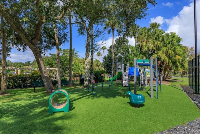 view of playground with a lawn