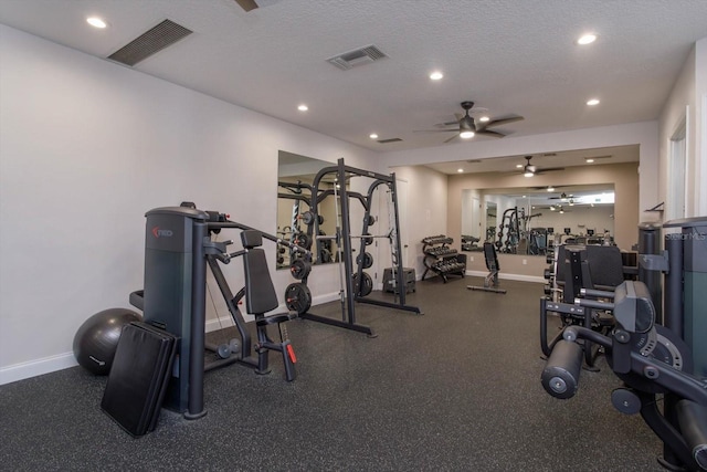 workout area with a textured ceiling and ceiling fan