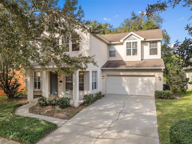 view of front facade with a front yard and a garage