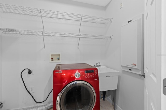 laundry area with washer / dryer and sink