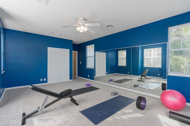 workout room featuring carpet floors and ceiling fan