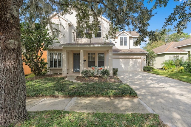 view of front of home featuring covered porch and a garage