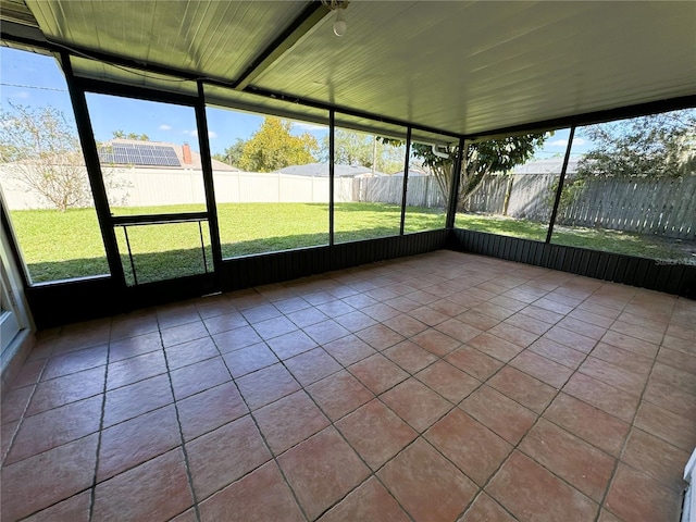 unfurnished sunroom featuring plenty of natural light