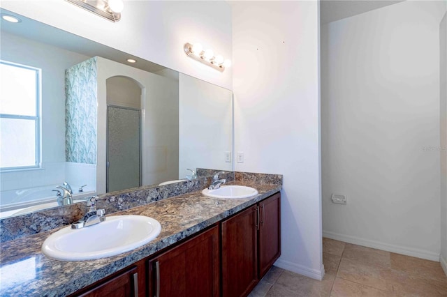 bathroom with vanity, tile patterned floors, and independent shower and bath