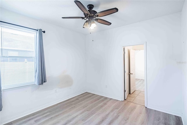 unfurnished room with light wood-type flooring and ceiling fan