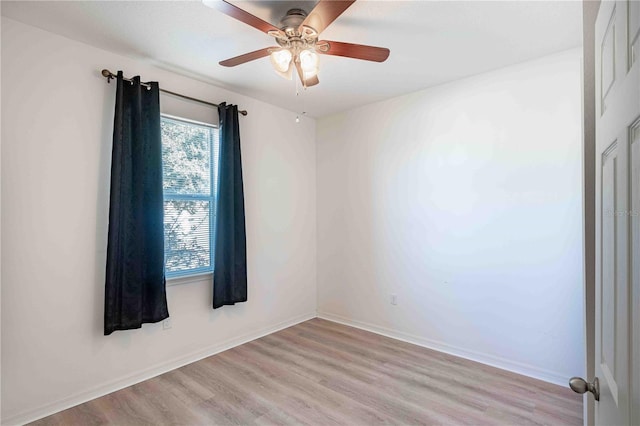 unfurnished room with light wood-type flooring and ceiling fan