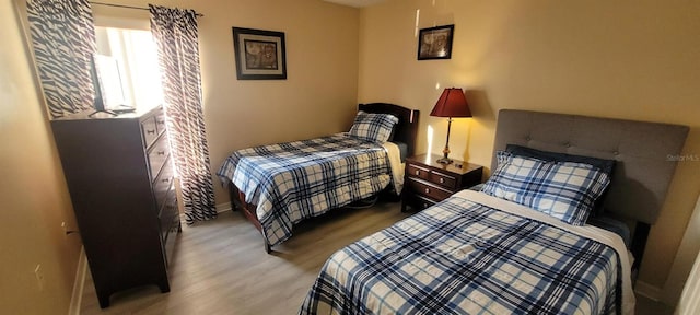 bedroom with light hardwood / wood-style floors