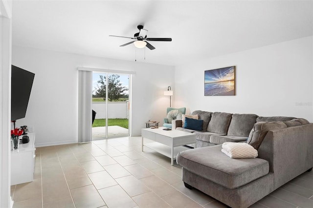 living room with ceiling fan and light tile patterned floors