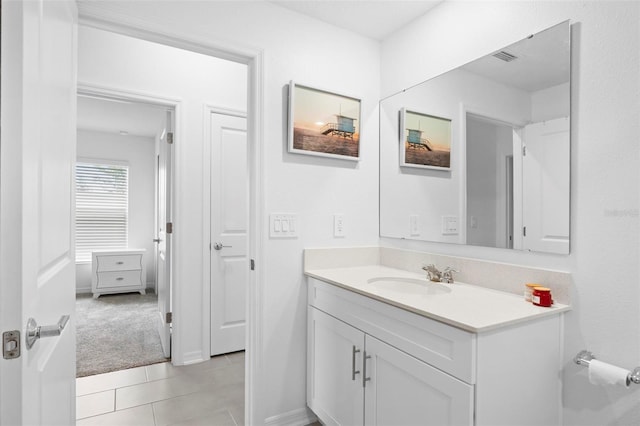 bathroom with vanity and tile patterned flooring