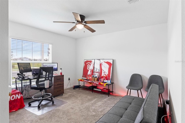 office space with ceiling fan and carpet