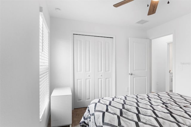 bedroom featuring carpet floors, a closet, and ceiling fan