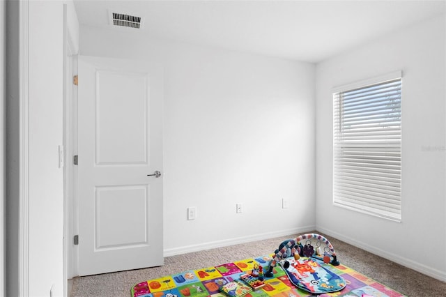 game room featuring light colored carpet