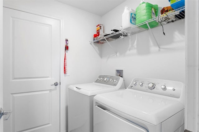 clothes washing area featuring washing machine and clothes dryer