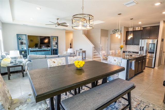 dining room with visible vents, stairs, light tile patterned floors, recessed lighting, and ceiling fan with notable chandelier