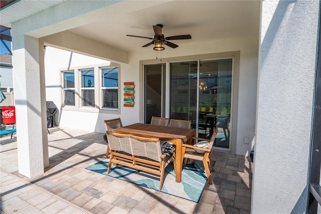 view of patio / terrace with ceiling fan and outdoor dining area