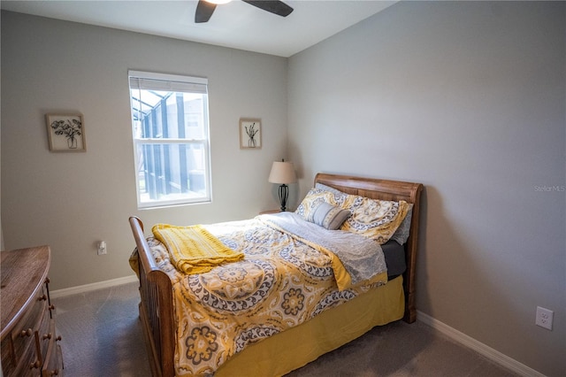 bedroom with baseboards, dark carpet, and a ceiling fan