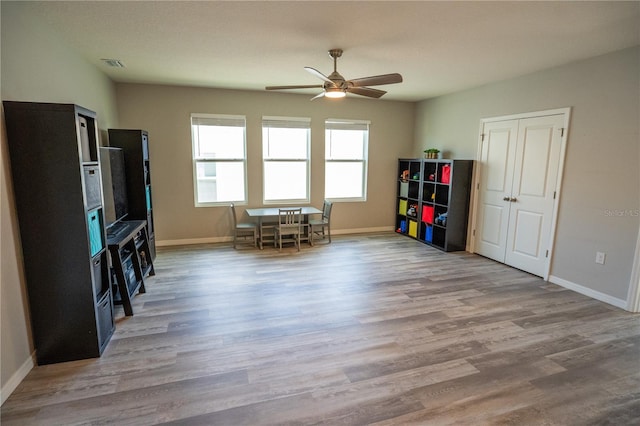 game room featuring wood finished floors, visible vents, and baseboards