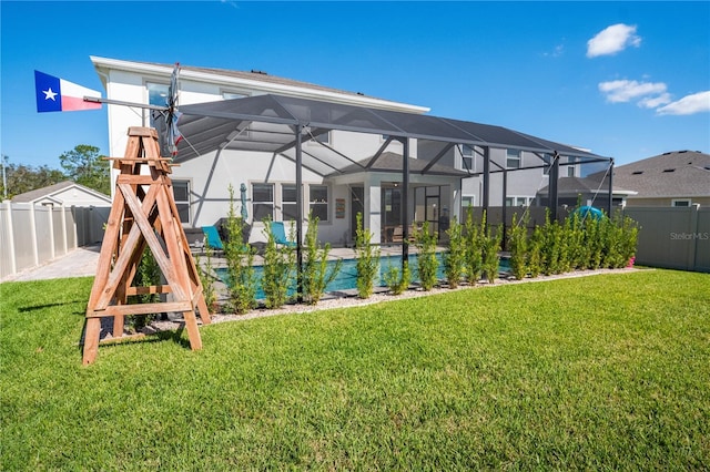 view of yard featuring glass enclosure, a fenced in pool, and a fenced backyard