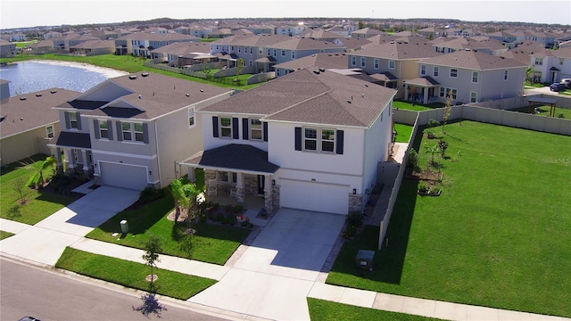 aerial view featuring a residential view and a water view