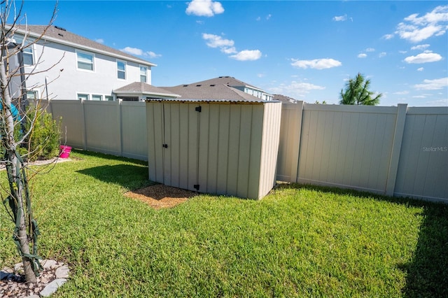 view of yard featuring an outbuilding and a fenced backyard