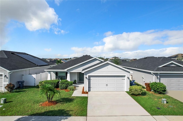 ranch-style house with a front lawn and a garage