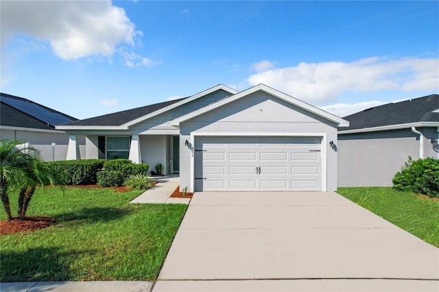 ranch-style home featuring a front lawn and a garage