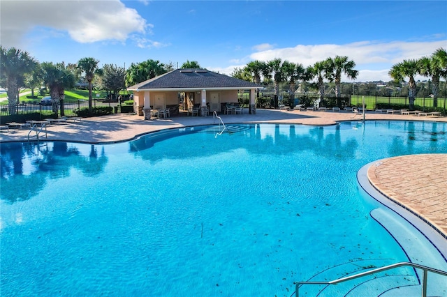 view of swimming pool with a patio area