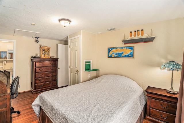 bedroom featuring dark wood-type flooring